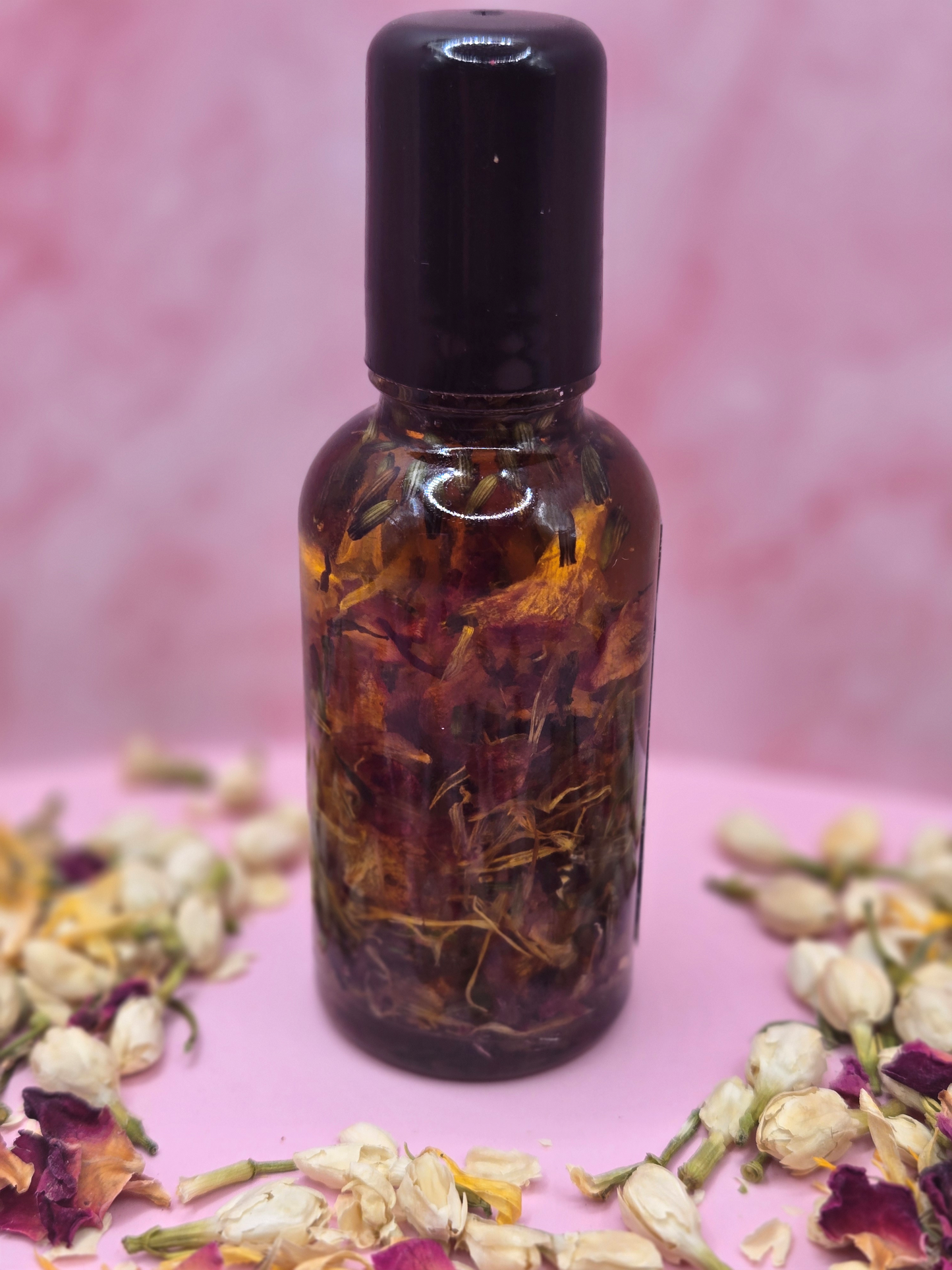 Dollhouse Botanicals Memoir Flora Face Hydrator with real floating flowers in clear glass bottle with black top