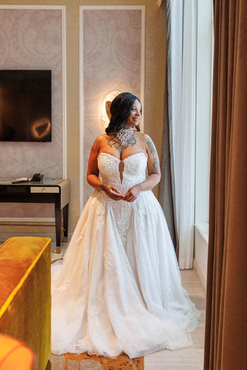  Alexis Clements is the Witch of Flowers and the founder and owner of Dollhouse Botanicals. Photo of Alexis Clements in elegant white couture gown.