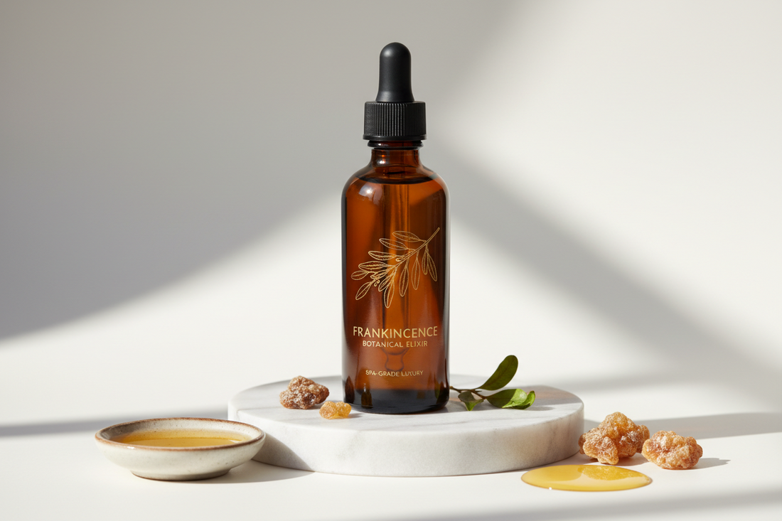 bottle of frankincense oil sitting on white surface