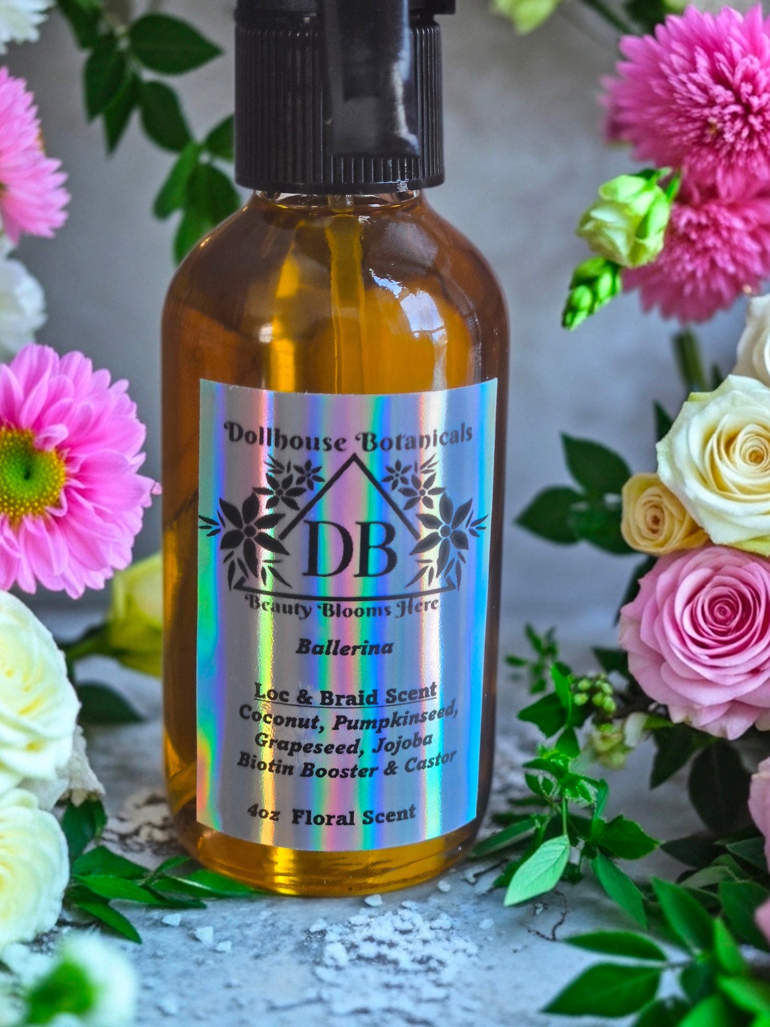 Bottle of Dollhouse Botanicals Bay Rum Loc and Beard Scent, held up by hand.