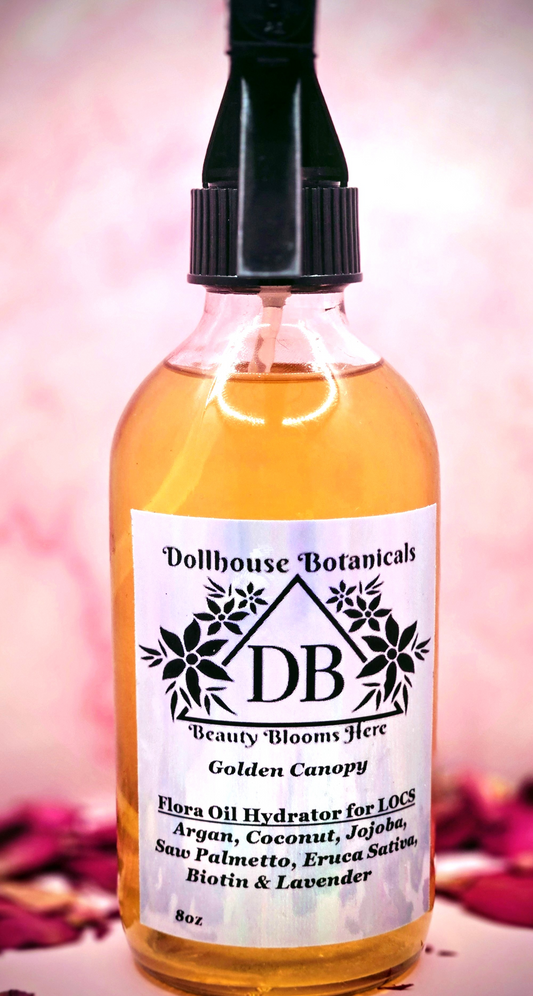 Dollhouse Botanicals Golden Canopy Flora Oil Hydrator for locs in pink glass bottle black sprayer