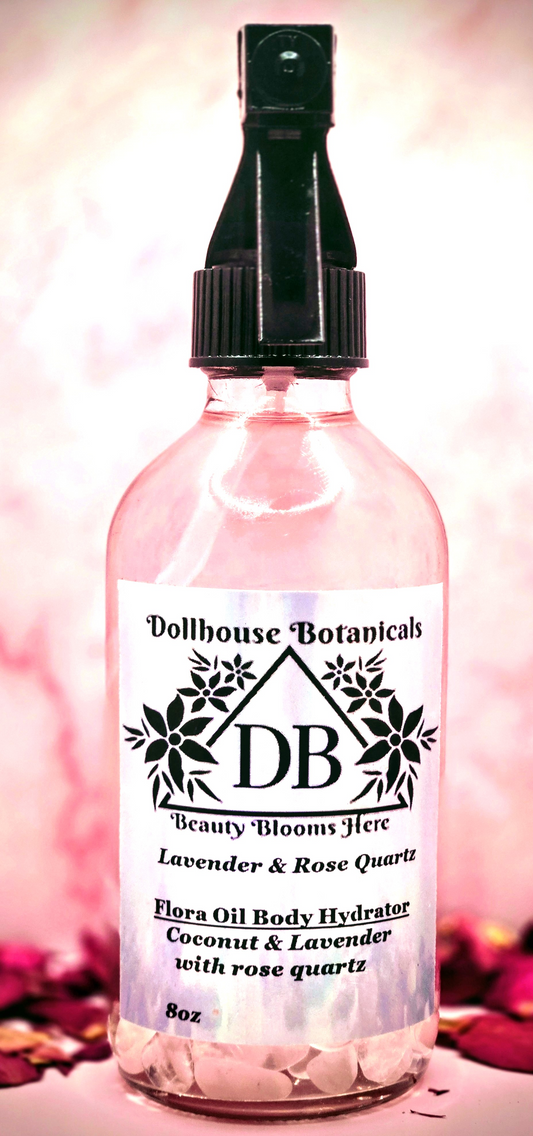 Dollhouse Botanicals Lavender and Rose Quartz Flora Oil Body Hydrator botanical oil in pink glass bottle with black sprayer