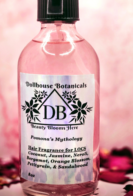 Dollhouse Botanicals Pomona's Mythology Hair Fragrance botanical oil for hair and locs in pink glass bottle with black sprayer