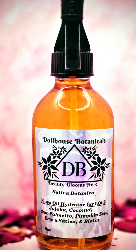 Dollhouse Botanicals Sativa Botanica Flora Oil Hydrator for locs in pink glass bottle with black sprayer